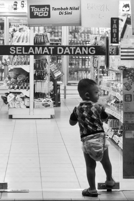 The 7-11 attendant was on "Break Meal", according to the sign on the door. This little man was not OK with that.
