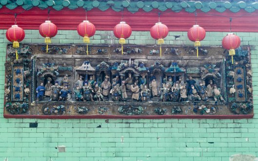 One of the carved panels on the side of Chan She Shu Yuen Temple.