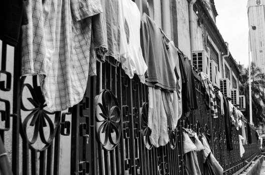 On the fence at the back  Chan She Shu Yuen Temple.  Apparently, anything will do in a pinch.