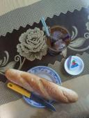 Fresh, warm bánh mì, a wedge of la vache qui rit, and a Saigon coffee = $1.18