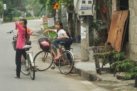Hue, Vietnam.  These girls seemed not at all impressed with my ability to drive a motorbike and take photos at the same time.