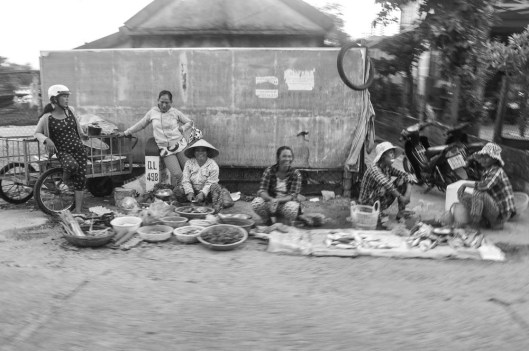 Hue, Vietnam. Even driving by on a motorbike at 30 kmph, they were still aware that there was a camera on them...